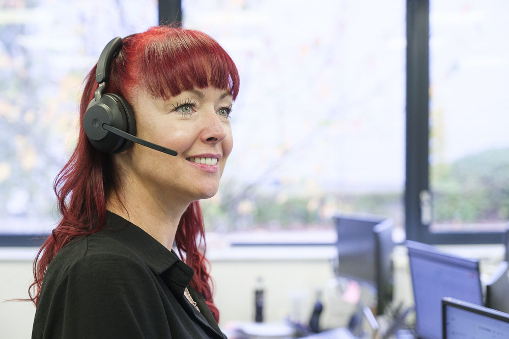 Lady speaking on the phone using a headset