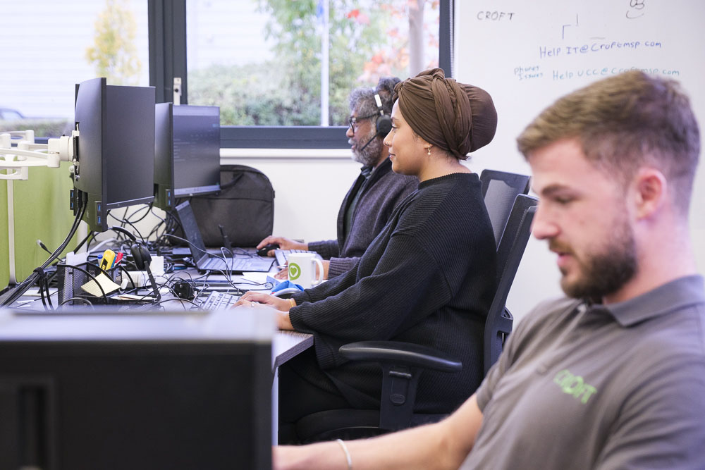 Croft meet the team employees working at their desktop computers in our Hertford office.